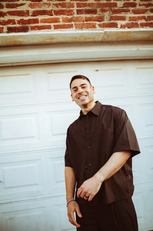 Andrew Weiss smiling in a press portrait