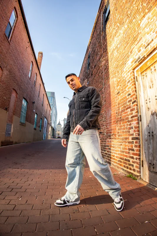 Andrew Weiss outdoors in a brick-lined alley
